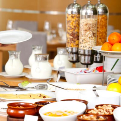 Man selecting his meal from a breakfast buffet Breakfast buffet